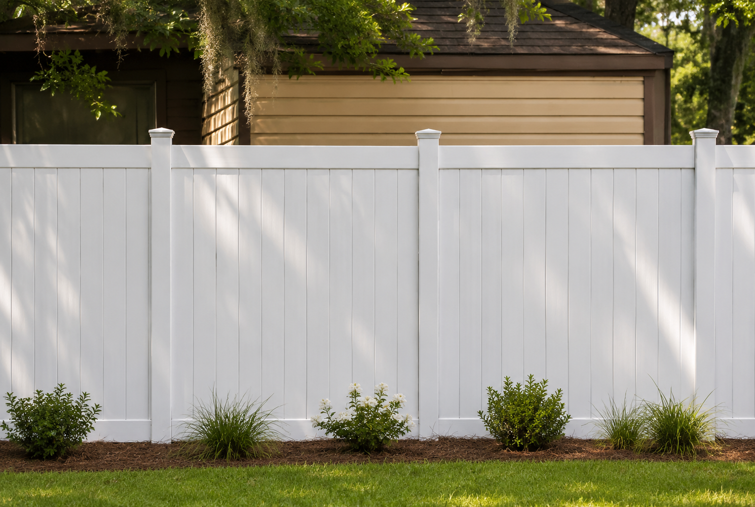 White vinyl fence installed by Ground Hog Fencing
